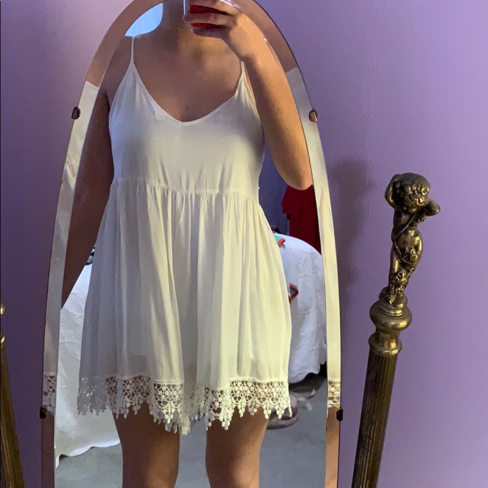 White romper with crotchet ends